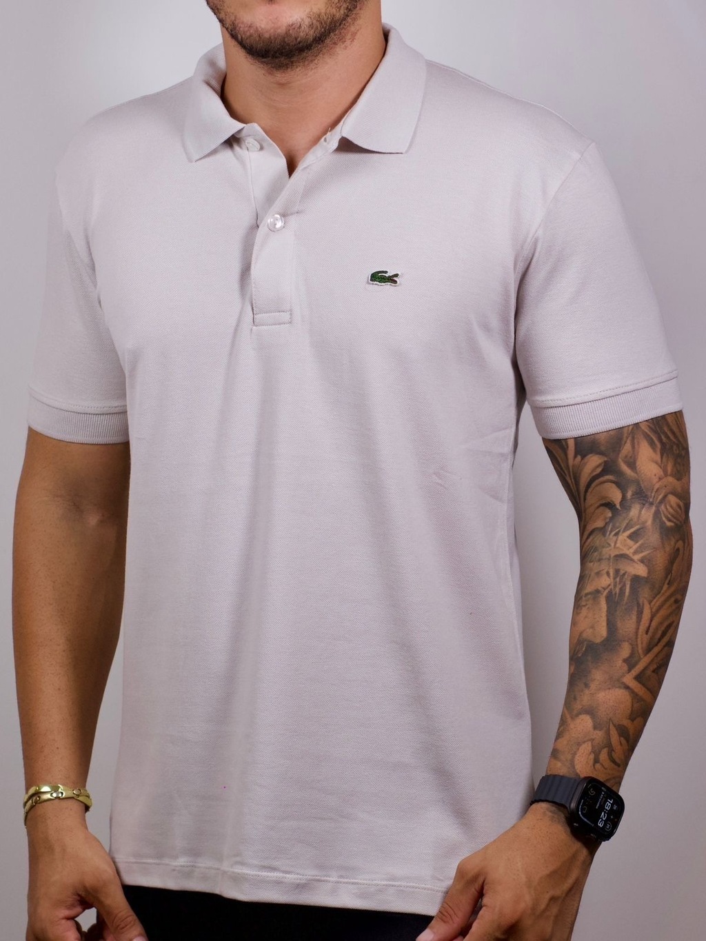 e2b7a5ce-aec1-4657-b3a0-7ccd624b6fb6-2ba13bc91fac1cb71617775193026830-1024-1024 Polo Lacoste Tradicional Cinza P - Imagem 1
